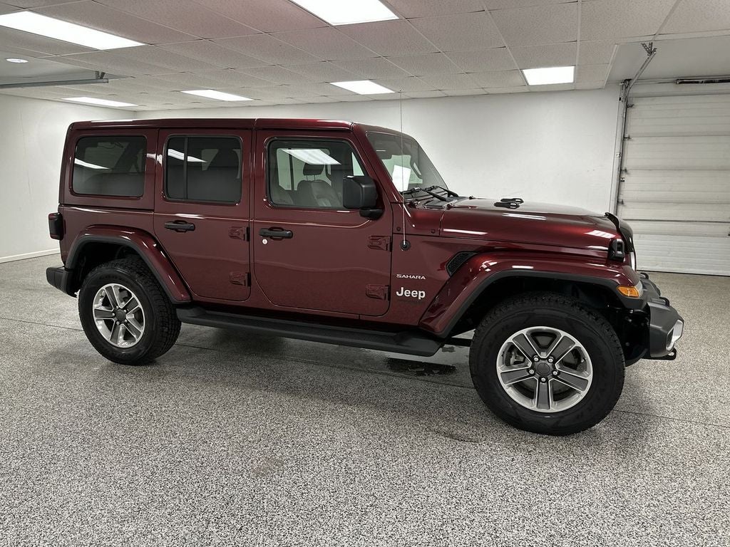 2021 Jeep Wrangler Unlimited Sahara in Snazzberry Pearlcoat — front three-quarter view