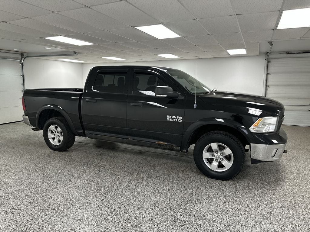 2014 RAM 1500 Outdoorsman in Black — front three-quarter view