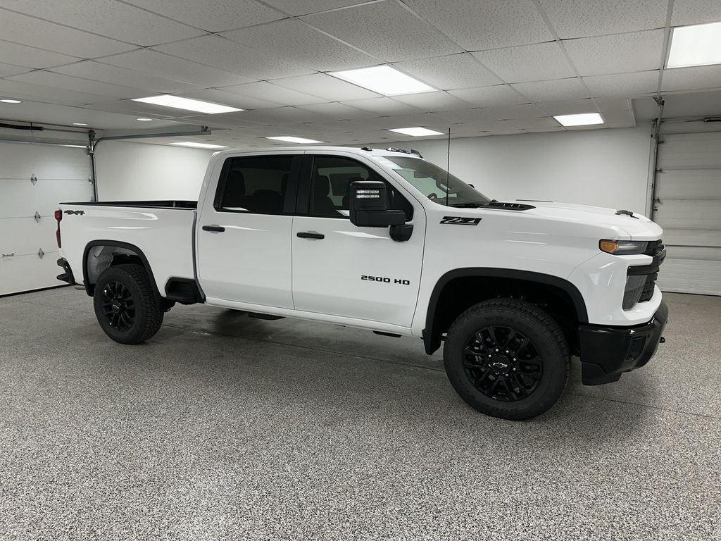 2026 Chevrolet Silverado 2500 HD Custom in Summit White — front three-quarter view